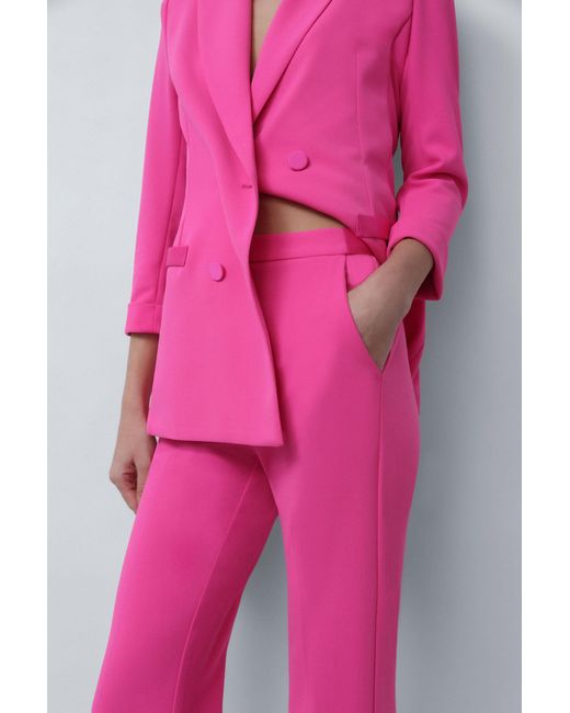 Pantalon évasé à poches verticales et plis marqués Imperial en coloris Pink