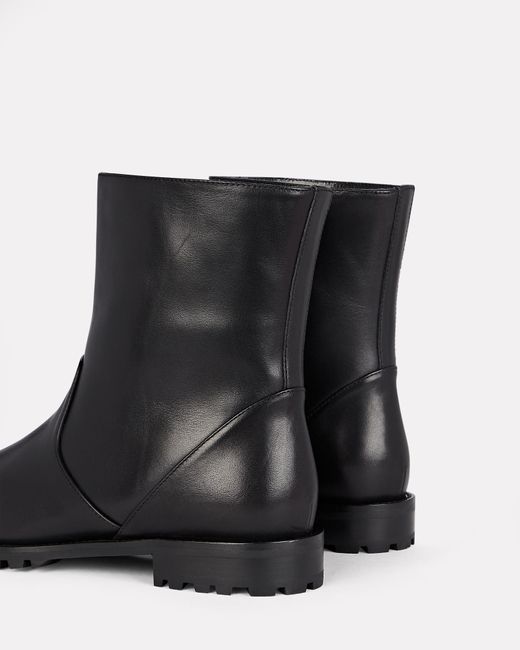 white leather flat ankle boots