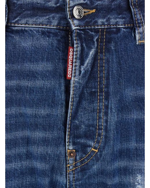 DSquared² Blue Jeans 642 With All-Over Ripped Details And Logo Patch On The Back for men