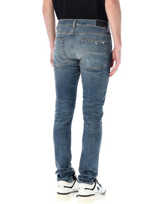 Amiri Blue Distressed Skinny Jeans for men