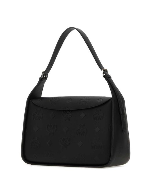 MCM Black Handbags.