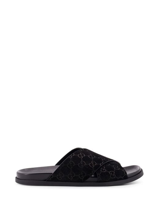 Gucci Black Leather Slides With All-Over Gg Motif for men