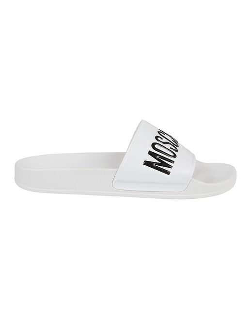 white moschino slides