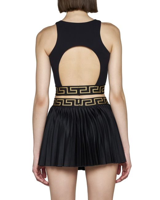 Versace Greca Border Pleated Gym Skirt in Black | Lyst