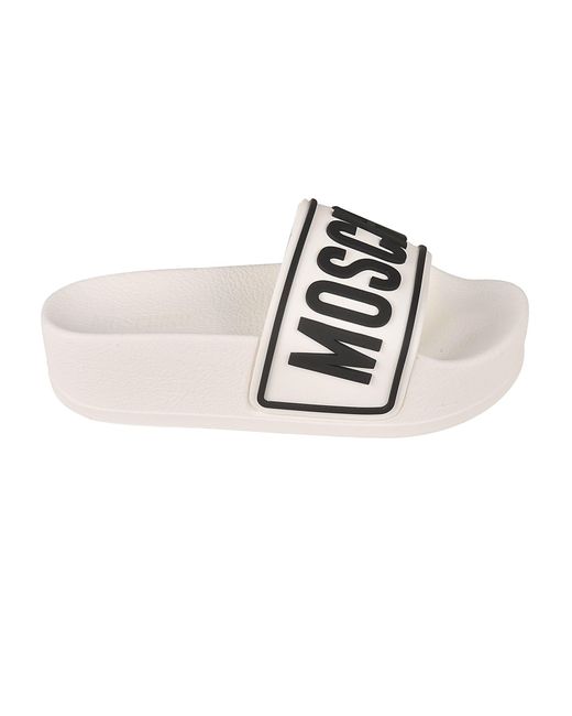 white platform sliders