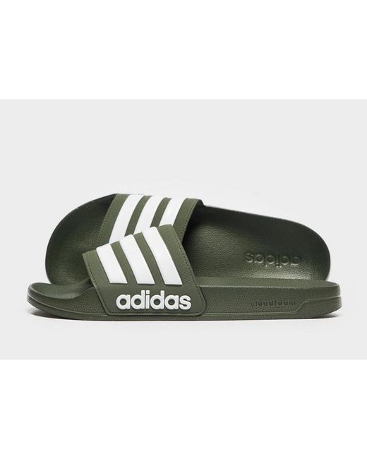 green and black adidas slides