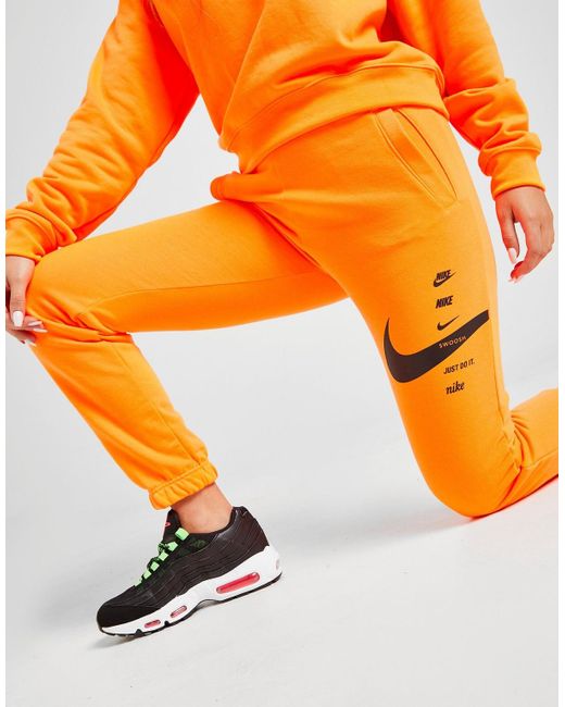Nike Swoosh Joggers in Orange - Lyst