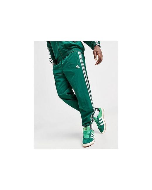 Adidas Originals Green Woven Firebird Track Pants for men