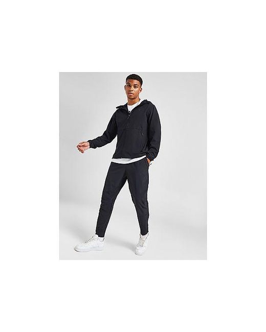 Unlimited Woven Track Pants di Nike in Black da Uomo