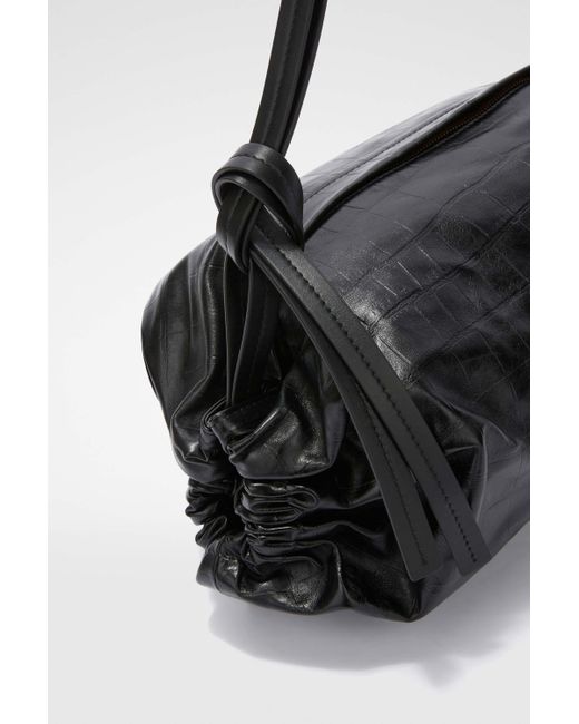 Cushion moyen modèle Jil Sander en coloris Black
