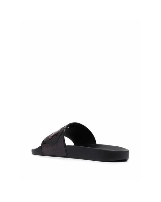 Ferragamo Black Groove Logo-Embossed Sliders for men