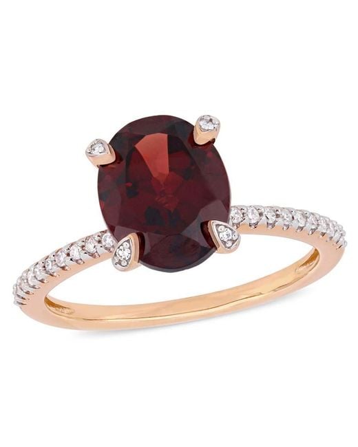 Amour Red 3 Ct Tgw Oval-Cut Garnet And 1/10 Ct Tw Diamond Ring