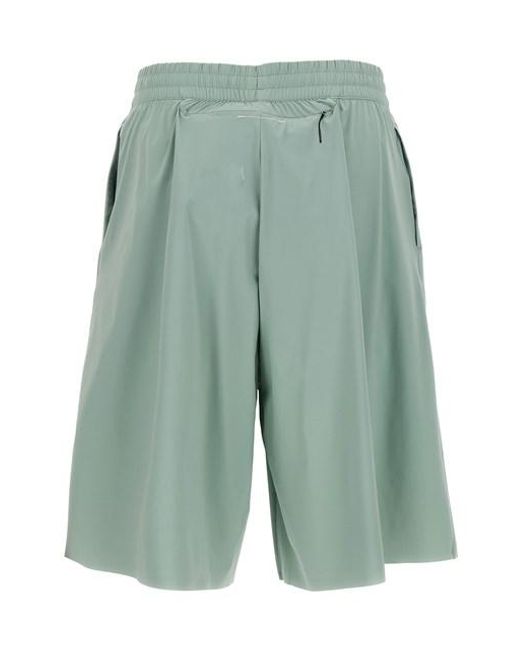 Bermuda X Salomon di MM6 by Maison Martin Margiela in Green da Uomo