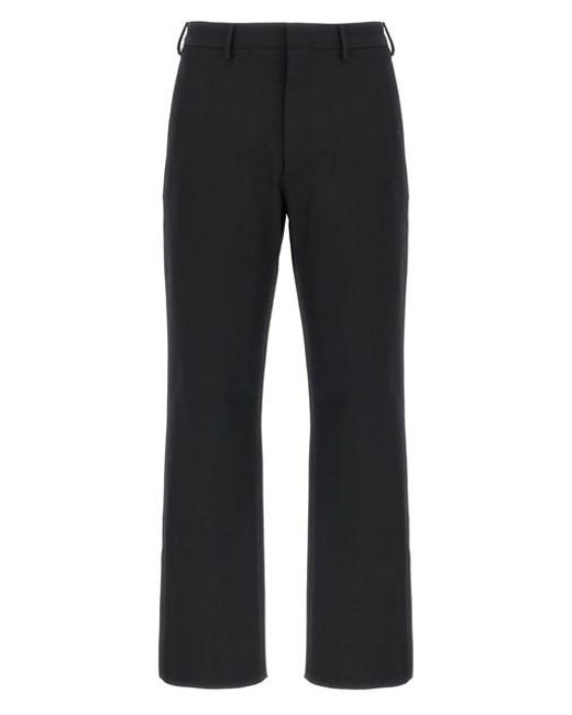 Pantalone techno stretch di Prada in Black da Uomo