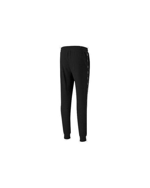 PUMA Black Ess+ Tape Sweatpants for men
