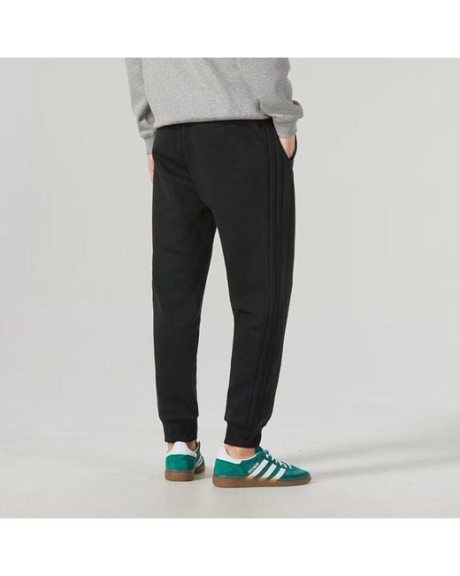 Adidas Black Essentials Fleece 3-Stripes Tapered Cuff Pants for men