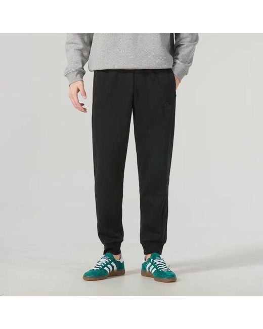 Adidas Black Essentials Fleece 3-Stripes Tapered Cuff Pants for men