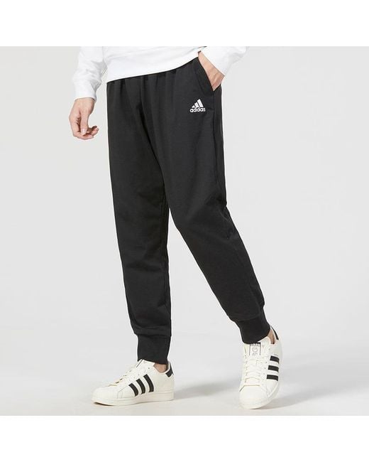 Adidas Black Essentials Logo Track Pants for men