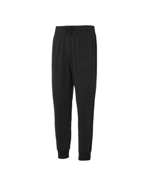 Adidas Black Essentials Fleece 3-Stripes Tapered Cuff Pants for men
