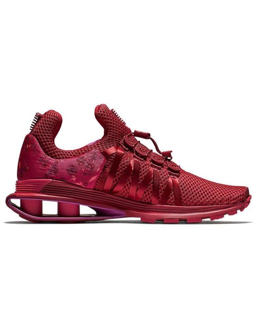 Nike gravity shox red sale