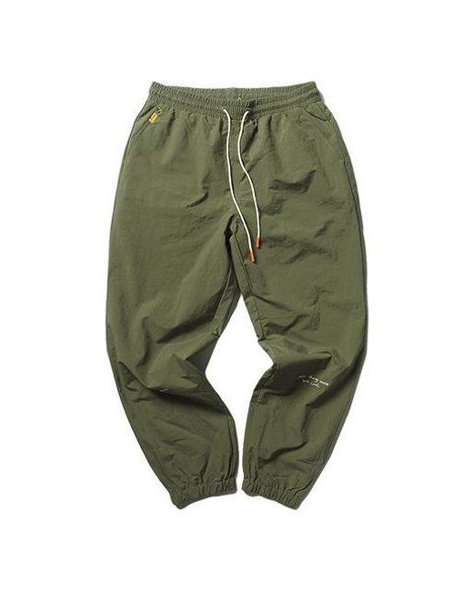 PUMA Green X Randomevent Woven Pants for men