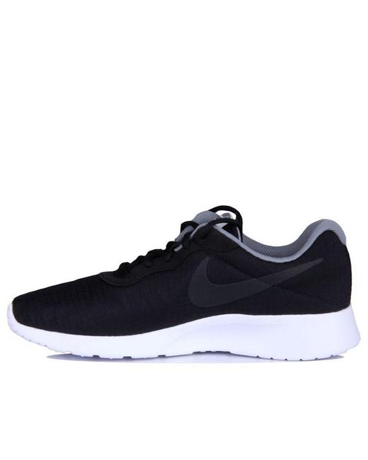 mens white nike tanjun