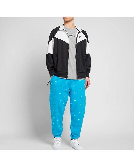 Nike Blue Nrg Swoosh Logo Full Print Straight Sports Pants/Trousers/Joggers for men