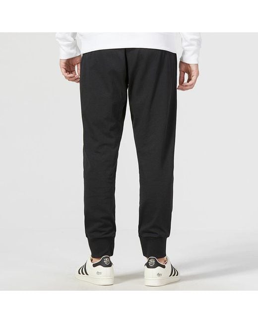 Adidas Black Essentials Logo Track Pants for men