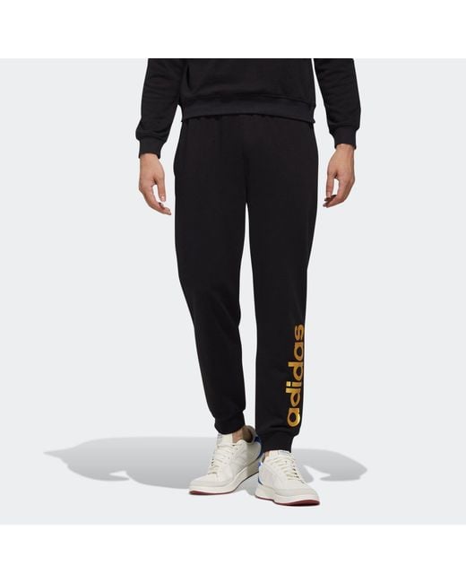 Adidas Black Neo Esntl Lg Tp 1 Metallic Logo Printing Bundle Feet Sports Pants/Trousers/Joggers for men