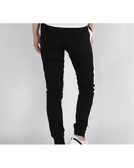 PUMA Black (Wmns) Iconic T7 Track Pants