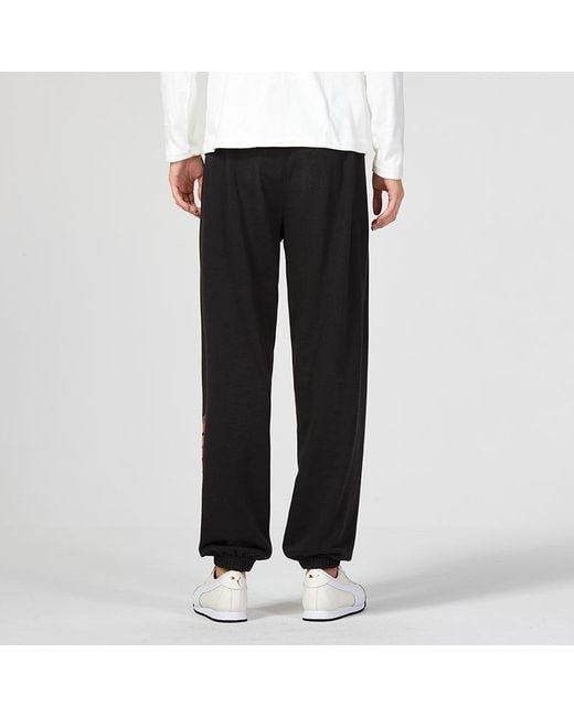 PUMA Black Essentials Cny Graphic Pants for men