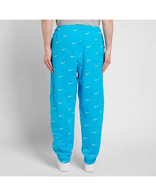Nike Blue Nrg Swoosh Logo Full Print Straight Sports Pants/Trousers/Joggers for men