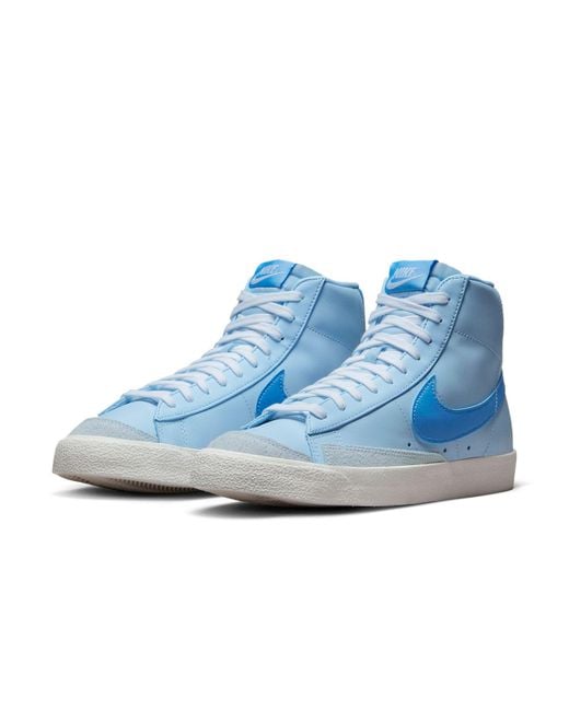 light blue swoosh nike blazers