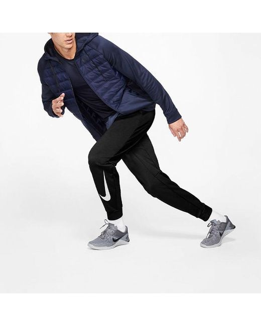 Nike Black Therma Tapered Swoosh Fleece Lined Sports Training Long Pants for men