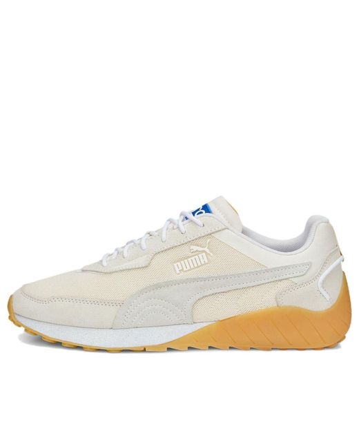 white pumas with gold toe