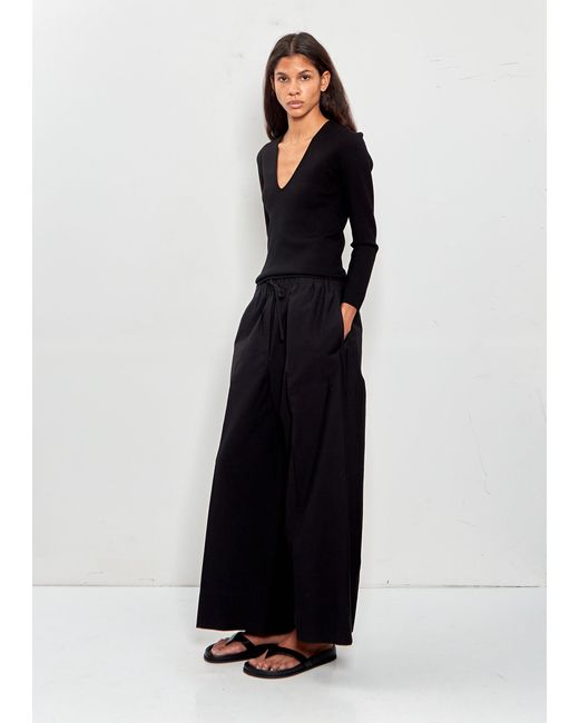 Totême Black Wide Summer Trousers
