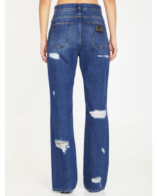 Jeans con strappi e stampa leo di Dolce & Gabbana in Blue