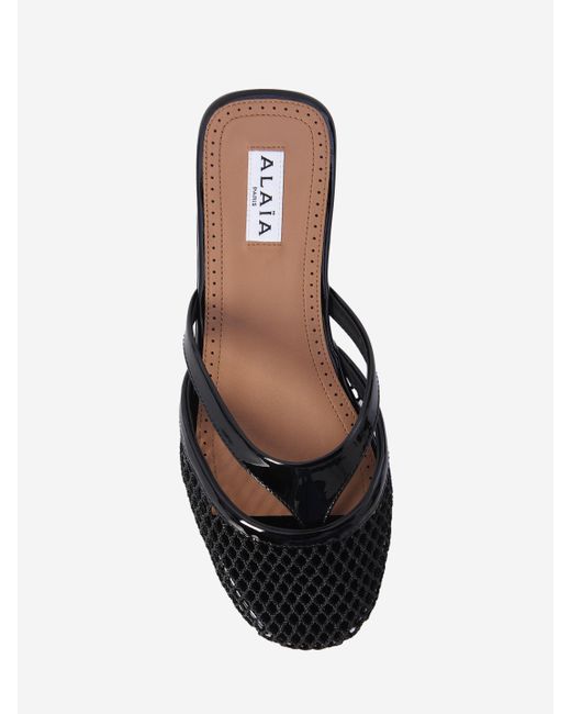 ALAIA PLATFORM THONG SANDALS 25S IN BLACK RAFFIA AND CALFSKIN