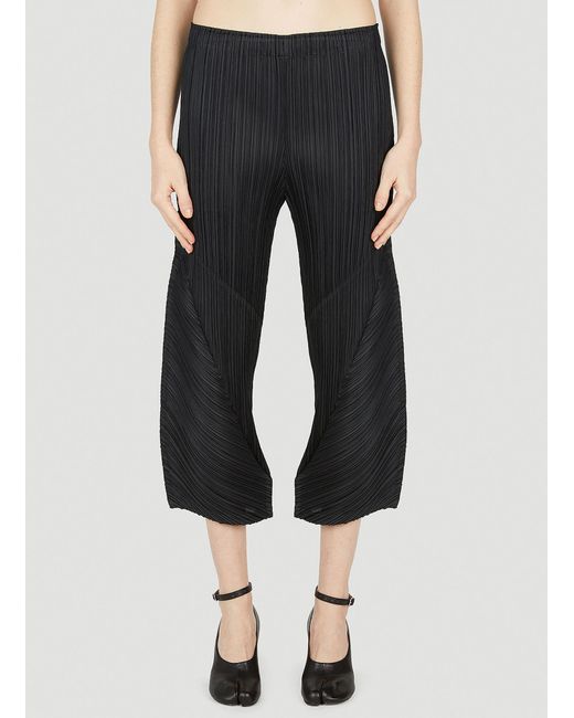Pleats Please Issey Miyake Cropped Pleated Pants in Black | Lyst