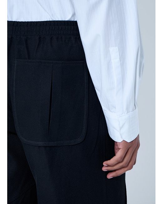 Kiko Kostadinov Blue High-Waisted Pleated Trousers for men