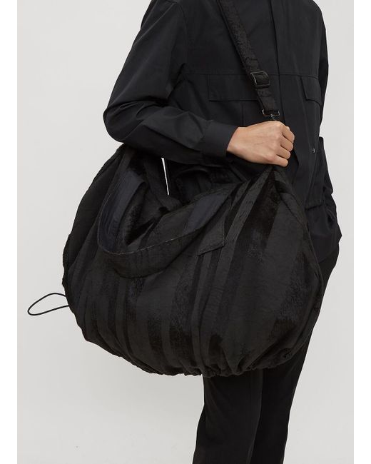 h:ours Black Mud Stripe Duffle Bag for men