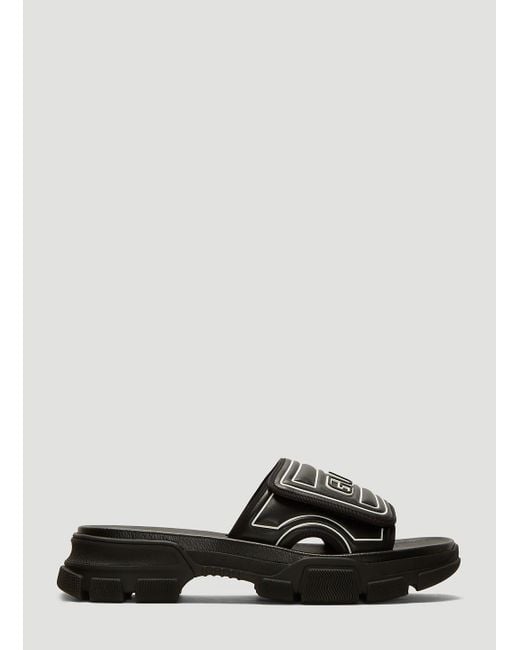 Gucci Black Logo-embossed Leather And Rubber Slides for men