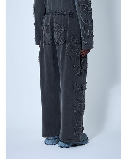 Acne Blue Distressed Logo Track Pants for men