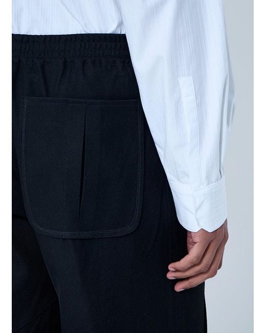 Kiko Kostadinov Blue High-Waisted Pleated Trousers for men