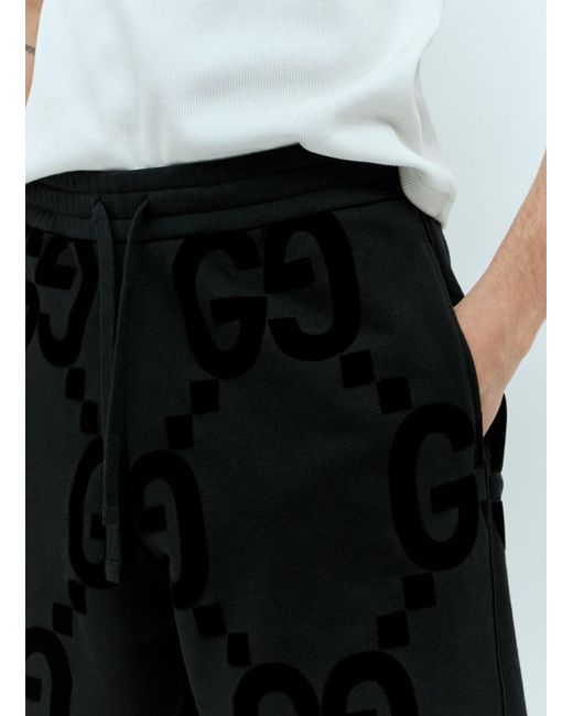 Gucci Black Gg Flocked Print Cotton-fleece Track Pants for men