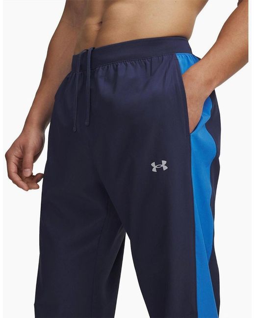 Under Armour Blue Storm Solid Patterned Running Pants for men