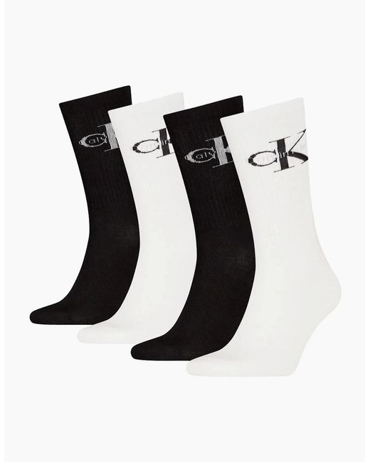 Calvin Klein Black 4-Pack Ck Jeans Logo Sports Socks Gift Tin for men