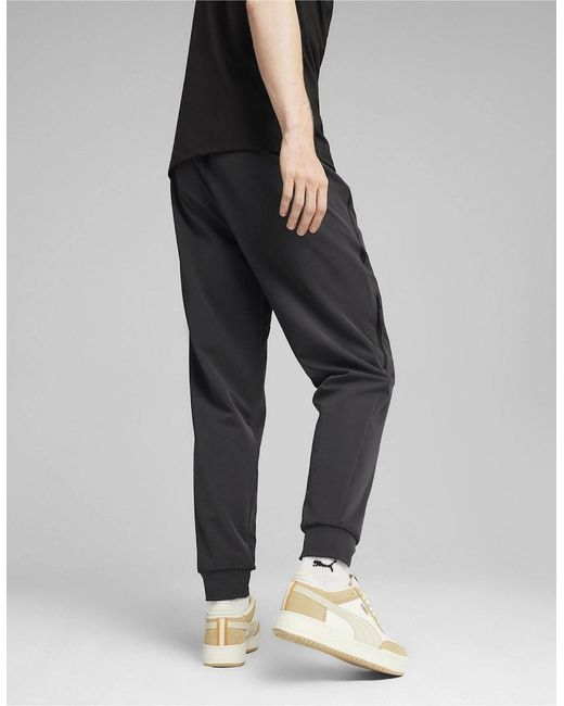 PUMA Black Zipped Pocket Solid Patterned Joggers for men