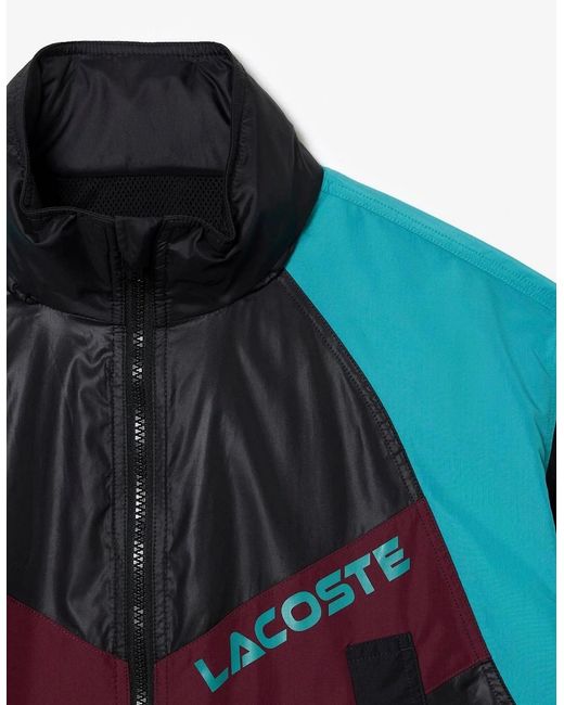 Lacoste Blue Hooded Neck Color Block Patterned Windbreaker With Zipped Pocket