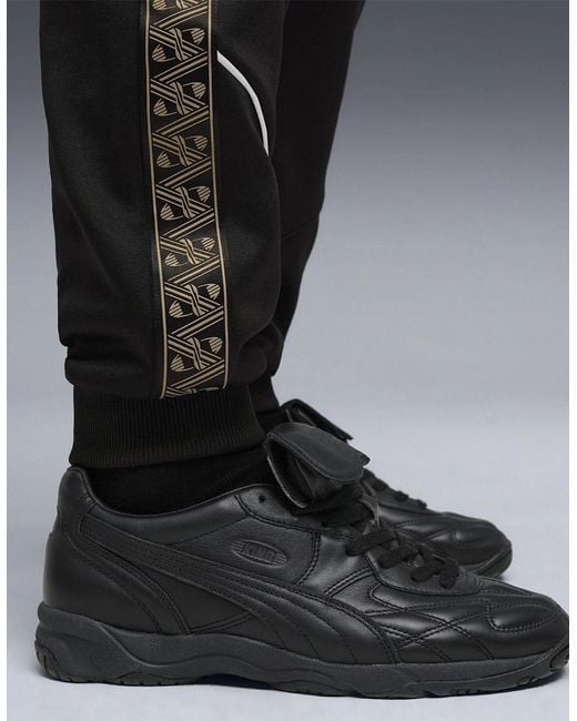 PUMA Black King Anthem Performance Tracksuit Bottoms for men